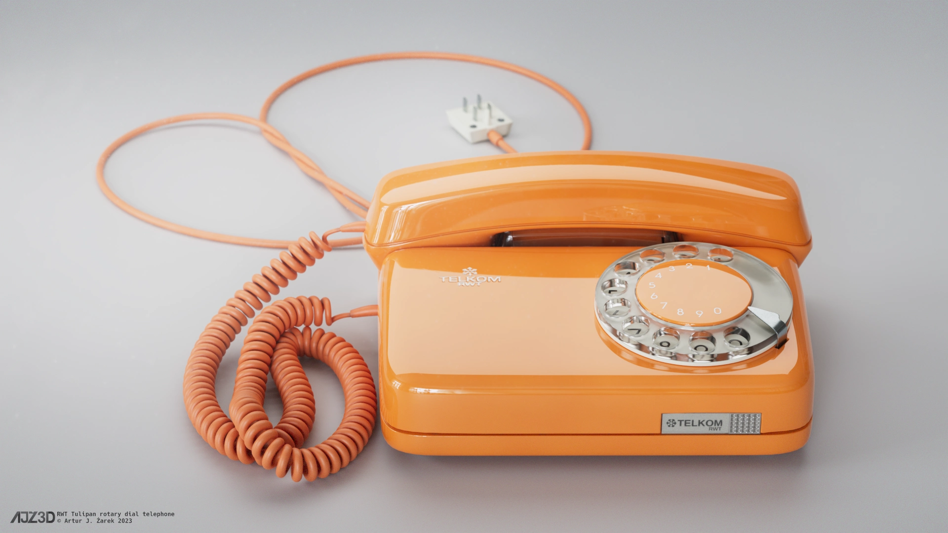 Front side of a glossy orange rotary dial telephone.