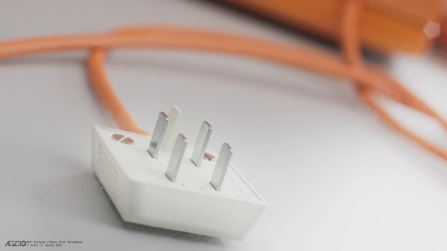 A close up of telephone's signal connection plug made from a white, but slightly yellowed plastic, four metallic bolts and one made of plastic.