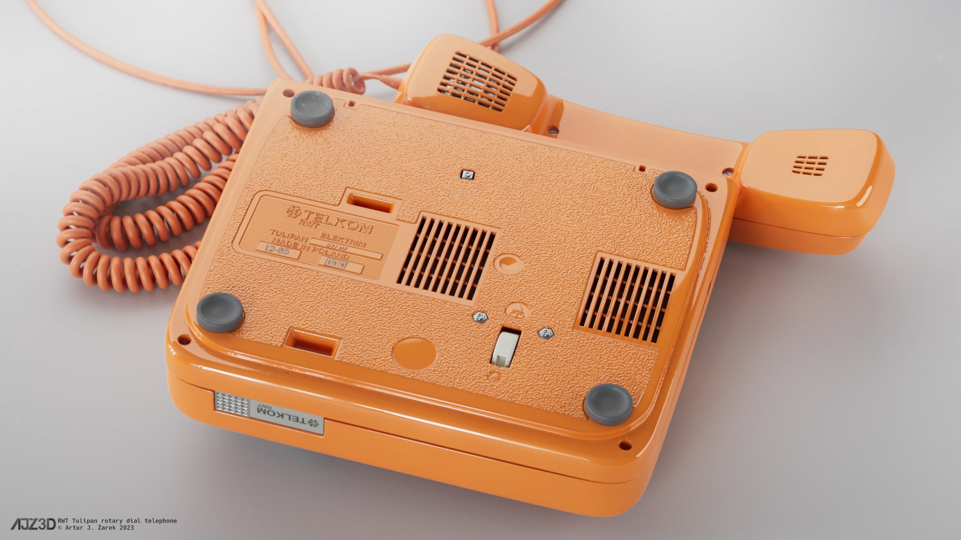 The telephone with unplugged receiver placed upside down with the details on its belly clearly visible.
