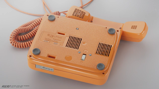 The telephone with unplugged receiver placed upside down with the details on its belly clearly visible.